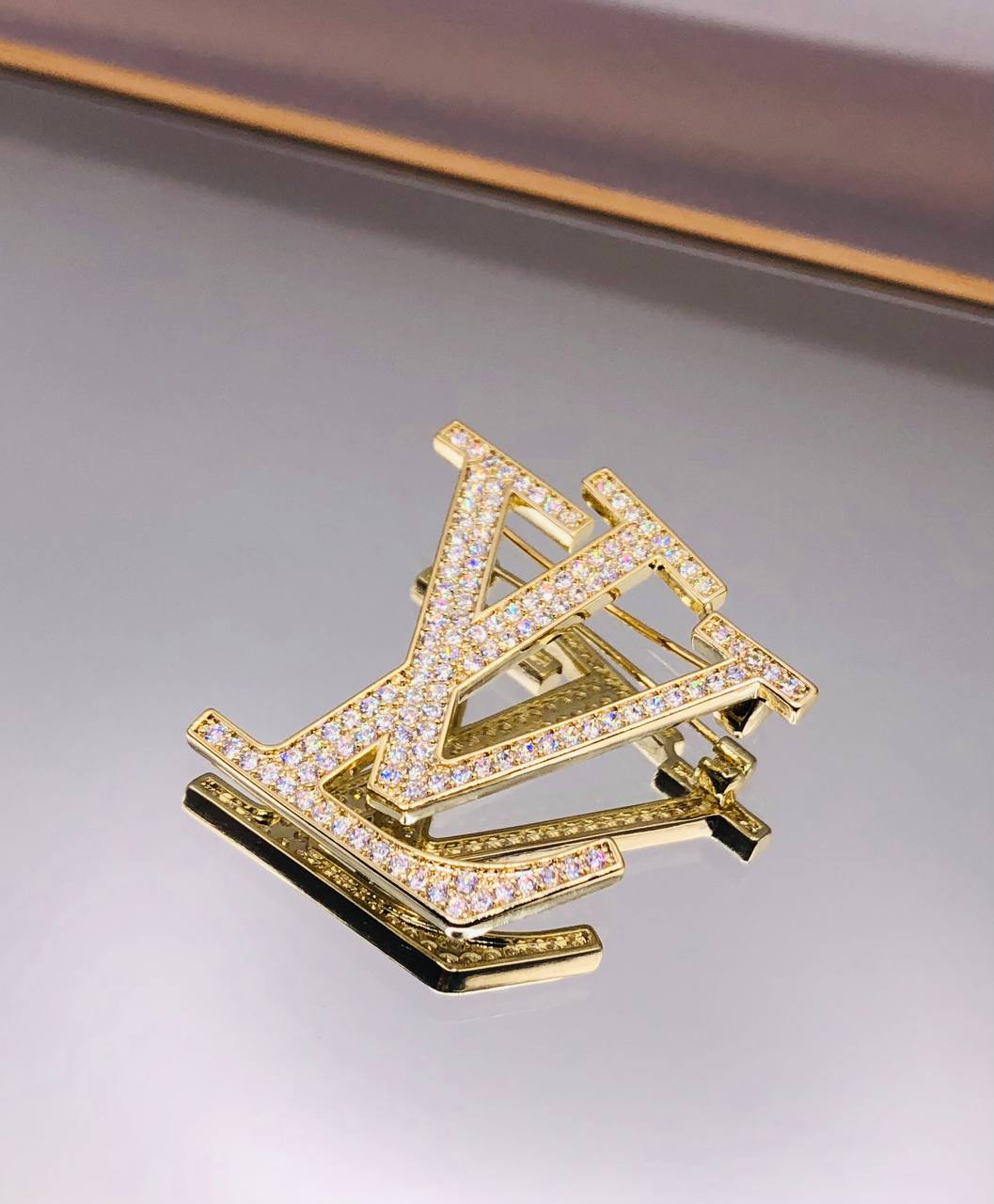 Broche Louis Vuitton Pour famme