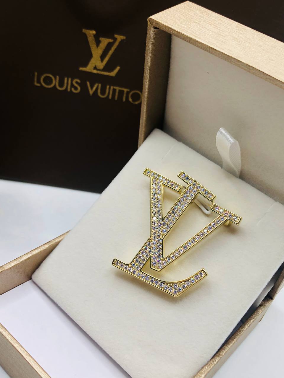 Broche Louis Vuitton Pour famme
