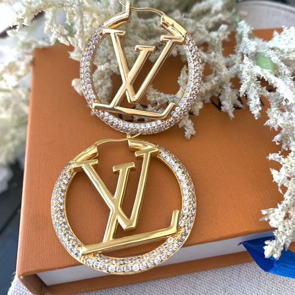 Boucles d’oreilles Louis Vuitton avec strass