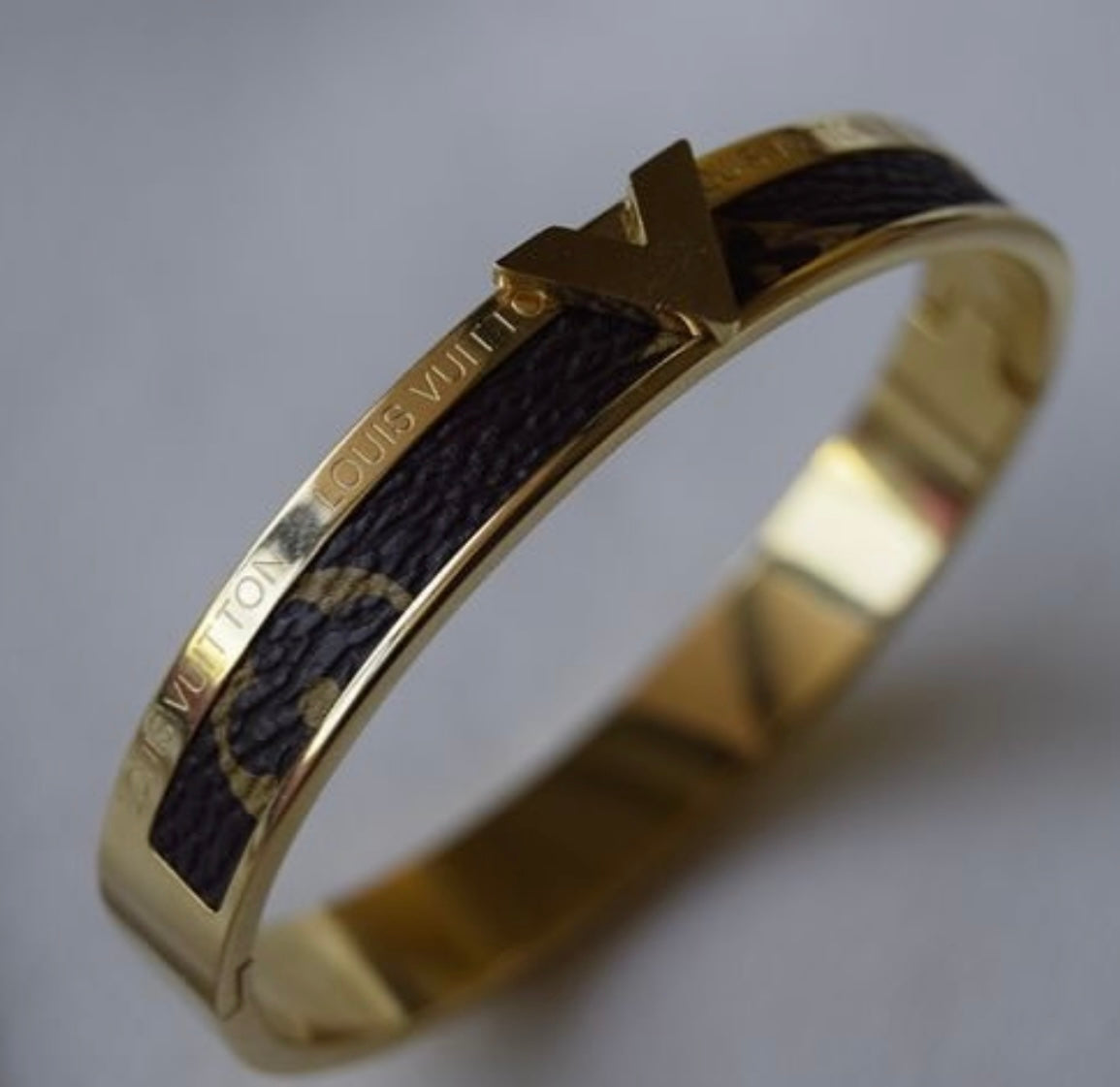 Bracelet Louis Vuitton doré avec cuir