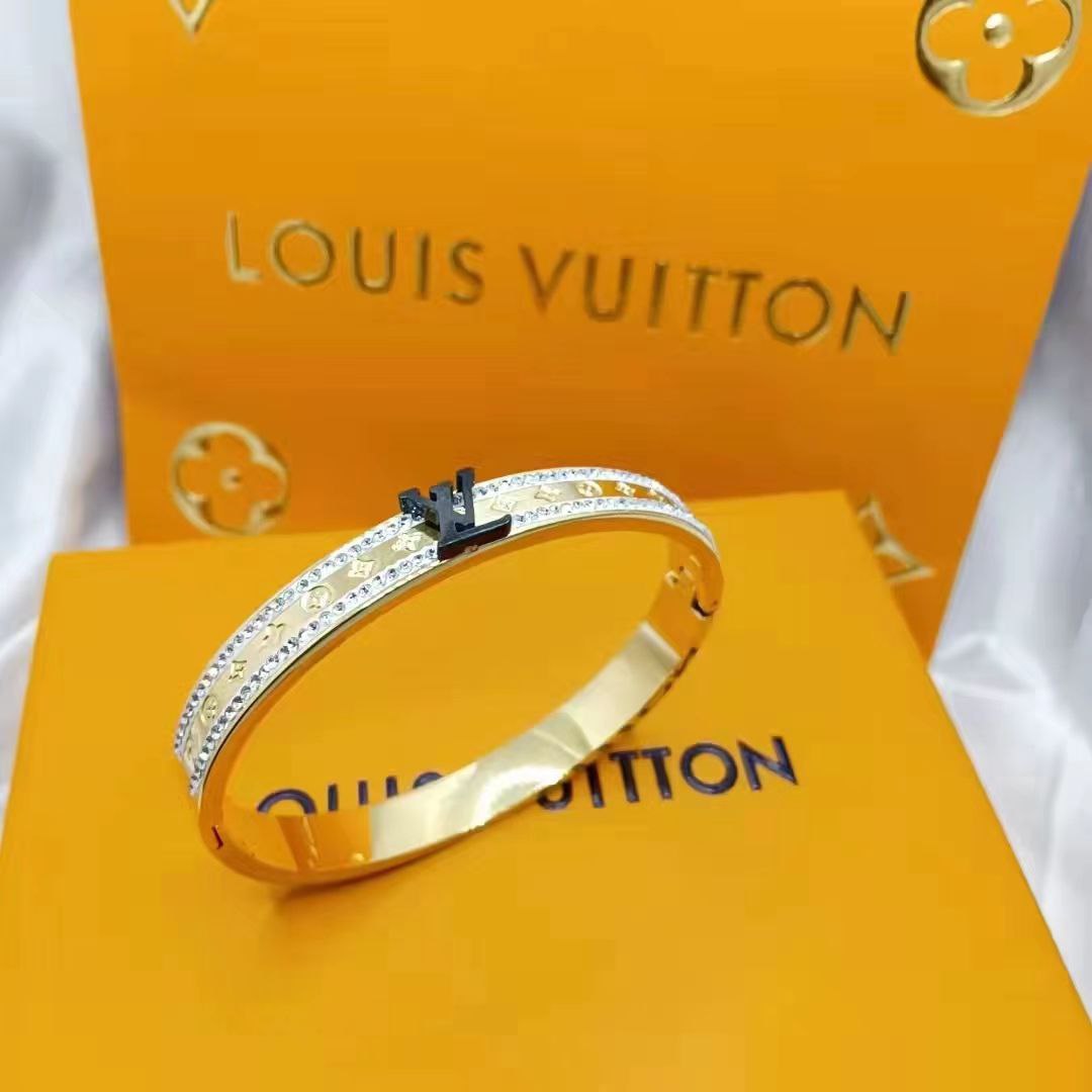 Bracelet Louis Vuitton doré LV