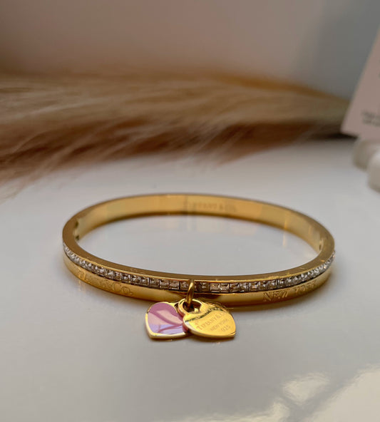 Bracelet Tiffany & Co doré avec coeurs