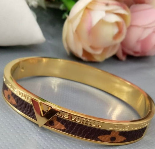 Bracelet Louis Vuitton doré avec cuir