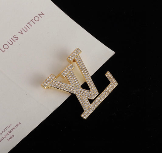 Broche Louis Vuitton avec strass