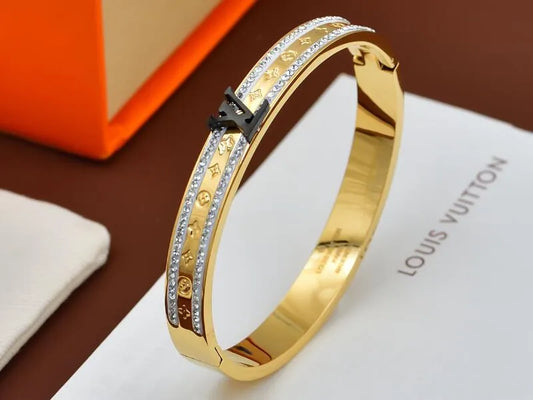 Bracelet Louis Vuitton doré LV